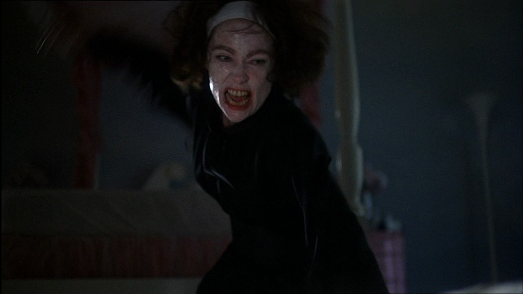 JoanBeatsChristinaWithWireHanger